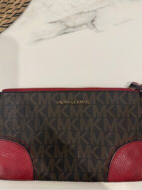 Michael Kors Brown Monogram Pouch with Red Accent Trim.. size Large wristlet
